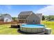 Backyard with pool, deck and covered patio perfect for outdoor living at 112 Roping Horn Way, Willow Springs, NC 27592