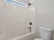 Clean bathroom showing a bathtub and shower combination with modern white tile at 112 Roping Horn Way, Willow Springs, NC 27592