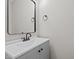 Stylish half bathroom featuring modern vanity, sleek mirror, and elegant fixtures at 112 Roping Horn Way, Willow Springs, NC 27592