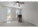 Comfortable bedroom featuring natural light, carpet, and a ceiling fan at 112 Roping Horn Way, Willow Springs, NC 27592