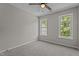 Neutral bedroom with windows offering ample natural light and soft carpet flooring at 112 Roping Horn Way, Willow Springs, NC 27592
