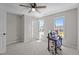 Bright bedroom with multiple windows, carpet flooring, and ample workspace at 112 Roping Horn Way, Willow Springs, NC 27592