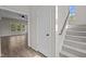 Welcoming foyer with staircase, light gray walls, and views of the living room at 112 Roping Horn Way, Willow Springs, NC 27592