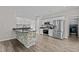 Updated kitchen boasts stainless steel appliances, stone accented bar and modern finishes at 112 Roping Horn Way, Willow Springs, NC 27592