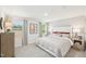 Comfortable bedroom with natural light, neutral tones, and stylish furniture for a serene retreat at 1169 Abbott St, Mebane, NC 27302