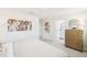A bright bedroom features contemporary art and stylish furnishings at 1169 Abbott St, Mebane, NC 27302
