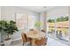 Cozy dining area with a round table, stylish chairs, and sliding glass doors to the backyard at 1169 Abbott St, Mebane, NC 27302