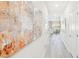 Hallway with artwork leading to a living space filled with natural light, creating an inviting atmosphere at 1169 Abbott St, Mebane, NC 27302