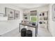 Stylish home office with modern desk, decor, shelving, and natural light, creating a productive workspace at 1169 Abbott St, Mebane, NC 27302