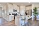 A stylish kitchen with white cabinets, a stainless steel appliances, a granite countertop, and a modern island at 1169 Abbott St, Mebane, NC 27302