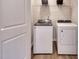 Convenient laundry room featuring a new washer and dryer set and storage shelves at 1169 Abbott St, Mebane, NC 27302