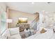Inviting living room with comfortable seating, TV, and staircase access, perfect for relaxation and entertainment at 1169 Abbott St, Mebane, NC 27302