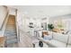 Open-concept living space with a modern kitchen, dining area, and cozy living room, ideal for Gathering gatherings at 1169 Abbott St, Mebane, NC 27302