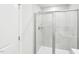 A clean, modern shower with glass doors and white tile surround at 1169 Abbott St, Mebane, NC 27302