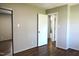 This bedroom features a closet with mirrored doors, hardwood flooring, and neutral paint colors at 1212 St. Marys Rd, Hillsborough, NC 27278