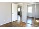This bedroom features hardwood flooring, mirrored closet doors and natural lighting at 1212 St. Marys Rd, Hillsborough, NC 27278