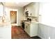 Stylish kitchen with white cabinets, stainless steel appliances, and modern backsplash at 1212 St. Marys Rd, Hillsborough, NC 27278
