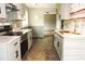 Updated kitchen featuring white cabinets, stainless steel appliances, and modern countertops at 1212 St. Marys Rd, Hillsborough, NC 27278