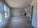 Unfurnished bedroom with new windows, neutral paint, and carpet flooring ready for personalization at 1239 Hammond Dr, Mebane, NC 27302