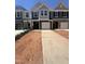 New construction townhomes feature a classic design, garages, and ample parking in a well-planned community at 1239 Hammond Dr, Mebane, NC 27302