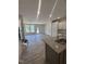 Spacious living room featuring modern grey wood floors, recessed lighting, and an open floor plan at 1255 Hammond Dr, Mebane, NC 27302