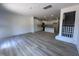 Bright open concept living room with wood floors, a staircase and direct access to the kitchen at 1255 Hammond Dr, Mebane, NC 27302