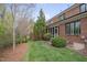 Picturesque backyard with mature trees and lush lawn, perfect for outdoor enjoyment at 129 Cofield Cir, Durham, NC 27707