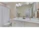 Bathroom showcasing a double sink vanity, toilet, and shower with a curtain at 129 Cofield Cir, Durham, NC 27707