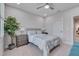 Bedroom featuring a gray headboard bed, neutral walls, and natural light at 129 Cofield Cir, Durham, NC 27707