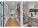 Elegant entryway with hardwood floors, staircase with rod iron railing, and decorative wainscoting at 129 Cofield Cir, Durham, NC 27707