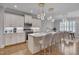 Modern kitchen with sleek countertops, stainless steel appliances, and stylish pendant lighting at 129 Cofield Cir, Durham, NC 27707