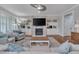 Cozy living room with fireplace, built-ins, and comfortable seating arrangement at 129 Cofield Cir, Durham, NC 27707