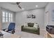 Office space with a ceiling fan, sofa, and neutral-colored carpet at 129 Cofield Cir, Durham, NC 27707