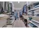 Walk-in closet boasting abundant storage space with shelving and hanging racks at 129 Cofield Cir, Durham, NC 27707