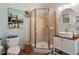 Bathroom features tiled shower, light blue paint, and white vanity at 1300 Marshall Farm St, Wake Forest, NC 27587