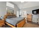 Bedroom featuring wood floors, natural light, vaulted ceiling, a ceiling fan, and a TV at 1300 Marshall Farm St, Wake Forest, NC 27587