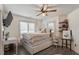 Charming bedroom with a platform bed, built-in drawers, wood floors, and a ceiling fan at 1300 Marshall Farm St, Wake Forest, NC 27587