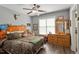 Themed bedroom features a comfortable bed, wood dresser, and ceiling fan, creating a unique and cozy space at 1300 Marshall Farm St, Wake Forest, NC 27587