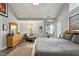 Large main bedroom with a vaulted ceiling, sitting area, hardwood floors, and access to a balcony at 1300 Marshall Farm St, Wake Forest, NC 27587