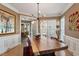 Dining room with hardwood floors, natural light, and elegant trim at 1300 Marshall Farm St, Wake Forest, NC 27587