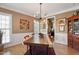 Dining room with hardwood floors and unique light fixture at 1300 Marshall Farm St, Wake Forest, NC 27587