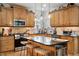 Eat in kitchen with island and stainless appliances at 1300 Marshall Farm St, Wake Forest, NC 27587