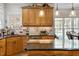 Kitchen featuring wood cabinets, stainless steel appliances, and kitchen island at 1300 Marshall Farm St, Wake Forest, NC 27587