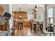 Charming kitchen with wood cabinets and stainless steel appliances adjacent to a dining area at 1300 Marshall Farm St, Wake Forest, NC 27587
