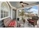 Inviting porch with wicker furniture and ceiling fan, offering a relaxing outdoor space at 1300 Marshall Farm St, Wake Forest, NC 27587