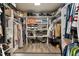 Walk-in closet with custom shelving and racks for ample storage of shoes, clothes, and accessories at 1300 Marshall Farm St, Wake Forest, NC 27587