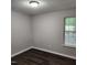 Bedroom featuring wood-look flooring, a standard window, and a neutral color palette at 132 Waiters Way Way, Youngsville, NC 27596