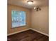 Cozy bedroom with natural lighting, wood-look flooring, and standard lighting fixtures at 132 Waiters Way Way, Youngsville, NC 27596