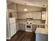 Well-lit kitchen featuring modern appliances, light-colored cabinets, and updated countertops at 132 Waiters Way Way, Youngsville, NC 27596