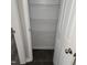 Walk-in pantry with a metal wire shelving system and wood-look floors at 132 Waiters Way Way, Youngsville, NC 27596